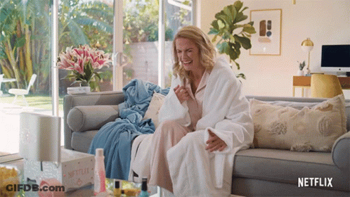 Woman In Bathrobe Sitting On Couch Netflix GIF