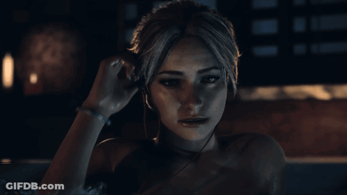 Woman In Bathtub Wearing Headphones Looking At Camera GIF