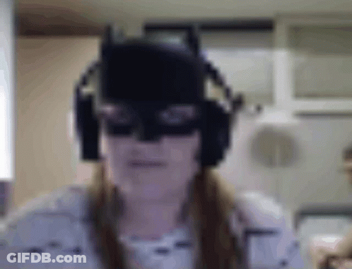 Woman In Batman Mask And Headphones Making Funny Face GIF