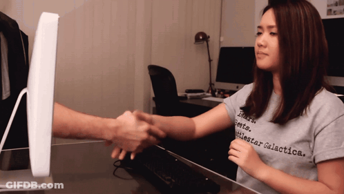 Woman In Battlestar Galactica Shirt Shaking Hands GIF