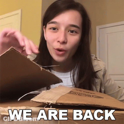 Woman In Beanie And Jacket Saying Alright GIF