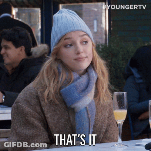 Woman In Beanie And Scarf Says That GIF