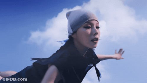 Woman In Beanie Flying GIF