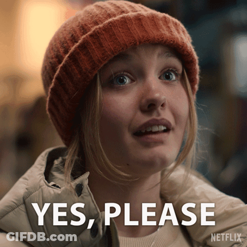 Woman In Beanie Saying Yes Please GIF