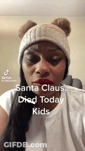 Woman In Beanie Says Santa Died GIF