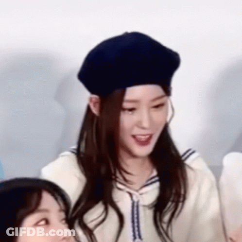 Woman In Beret And Sailor Suit Close Up GIF