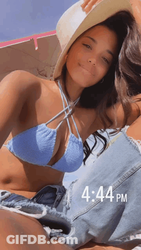 Woman In Bikini And Hat Laying On Beach 4:44 PM GIF