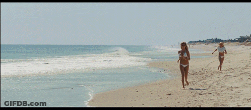 Woman In Bikini And Sunglasses On Beach GIF