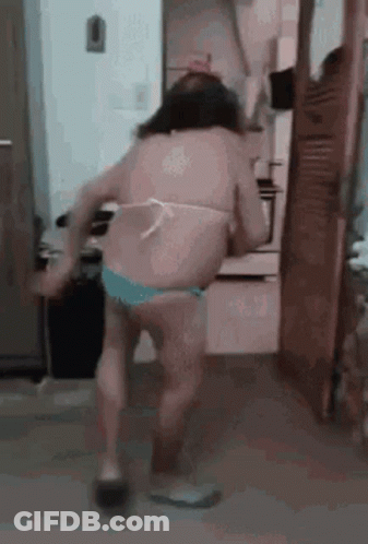 Woman In Bikini Dancing In Kitchen GIF
