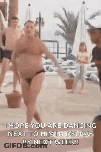 Woman In Bikini Dancing Next To Man In Delray Beach GIF