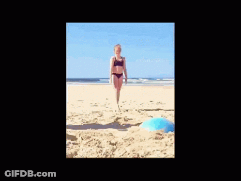 Woman In Bikini Doing Handstand On Beach GIF