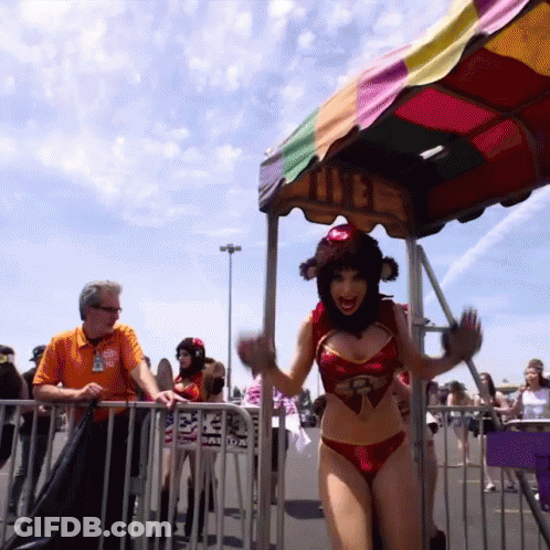 Woman In Bikini In Front Of Colorful Canopy GIF
