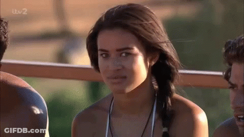 Woman In Bikini Poses For Camera With Two Men GIF