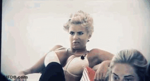 Woman In Bikini Sitting Legs Crossed Another Watching GIF