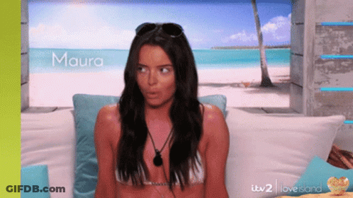Woman In Bikini Sitting On Couch Maura GIF
