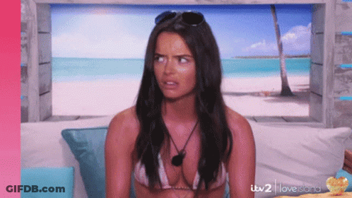 Woman In Bikini Sitting On Couch With ITV 2 Love Island GIF