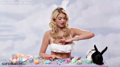 Woman In Bikini Sitting With Easter Eggs And Bunny GIF