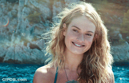 Woman In Bikini Smiling With Necklace GIF