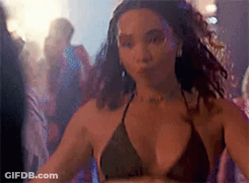 Woman In Bikini Top Dancing In Club GIF