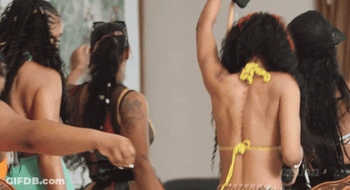 Woman In Bikini With Yellow String Necklace GIF