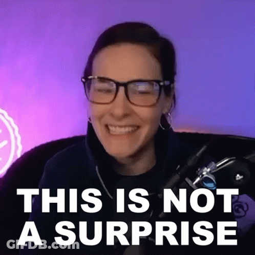 Woman In Black Adidas Hoodie And Hoop Earrings Looking At Camera GIF