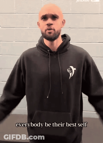 Woman In Black Adidas Sweater And Hat Pointing GIF