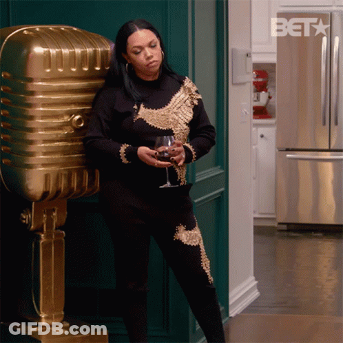 Woman In Black And Gold Holding Wine GIF
