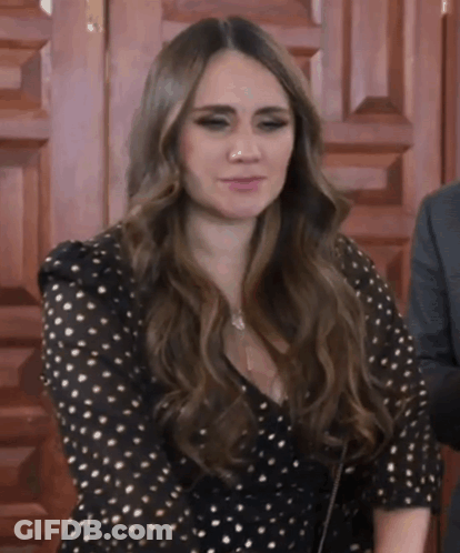 Woman In Black And Gold Polka Dot Dress GIF