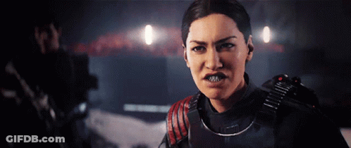 Woman In Black And Red Military Uniform Looks Angry GIF