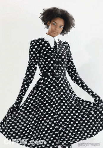 Woman In Black And White Butterfly Dress GIF