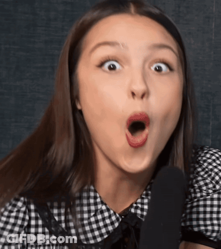 Woman In Black And White Checkered Shirt Surprised GIF