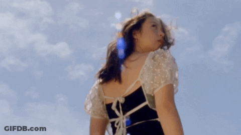 Woman In Black And White Dress Blue Sky GIF