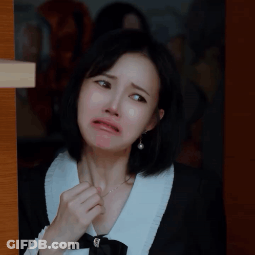 Woman In Black And White Dress Making Face GIF