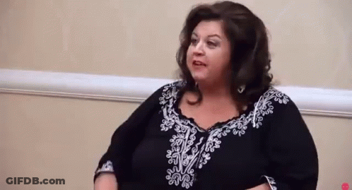 Woman In Black And White Dress Talking GIF