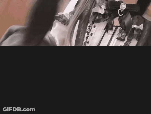 Woman In Black And White Dress With Ribbon GIF