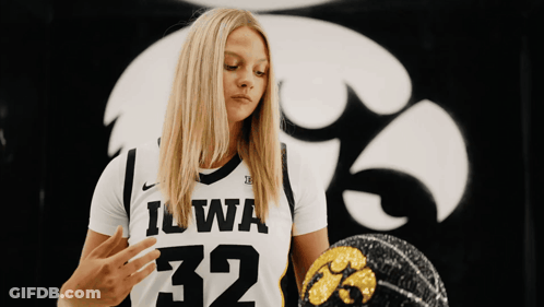 Woman In Black And White Iowa Jersey Holding Basketball GIF