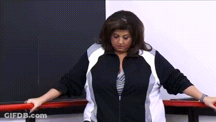 Woman In Black And White Jacket Next To Bar GIF