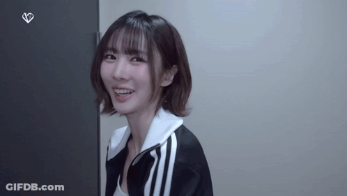 Woman In Black And White Jacket Smiling GIF
