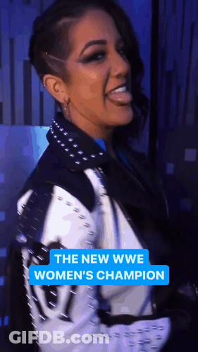 Woman In Black And White Jacket Smiling The New WWE Women's Champion GIF