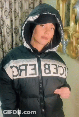 Woman In Black And White Jacket With Iceberg GIF
