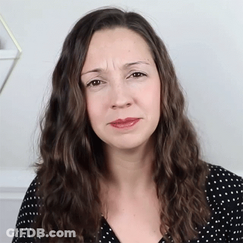 Woman In Black And White Polka Dot Shirt Making Funny Face GIF