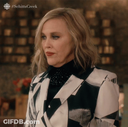 Woman In Black And White Suit Schitts Creek GIF