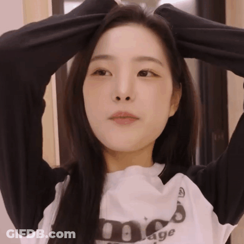 Woman In Black And White Sweatshirt Saying Age GIF