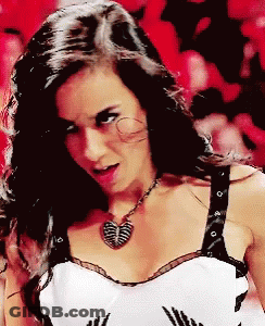 Woman In Black And White Top With Butterfly Necklace GIF