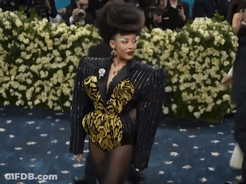 Woman In Black And Yellow Outfit GIF