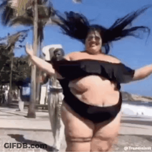 Woman In Black Bikini Dancing On Beach GIF