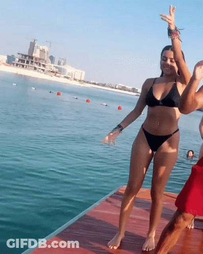 Woman In Black Bikini On Dock GIF