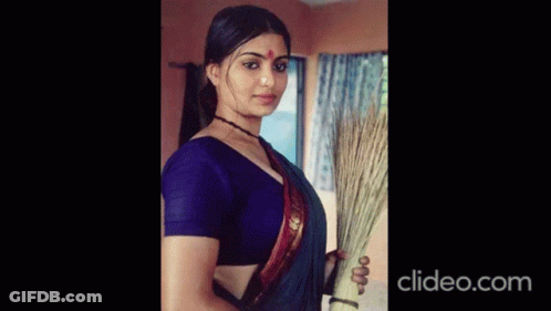 Woman In Black Blouse Holding Breasts GIF