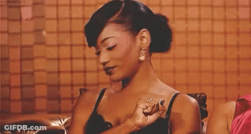 Woman In Black Bra And Earrings Sitting GIF