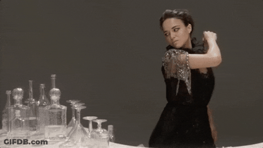 Woman In Black Breaking The Glasses On The Table GIF